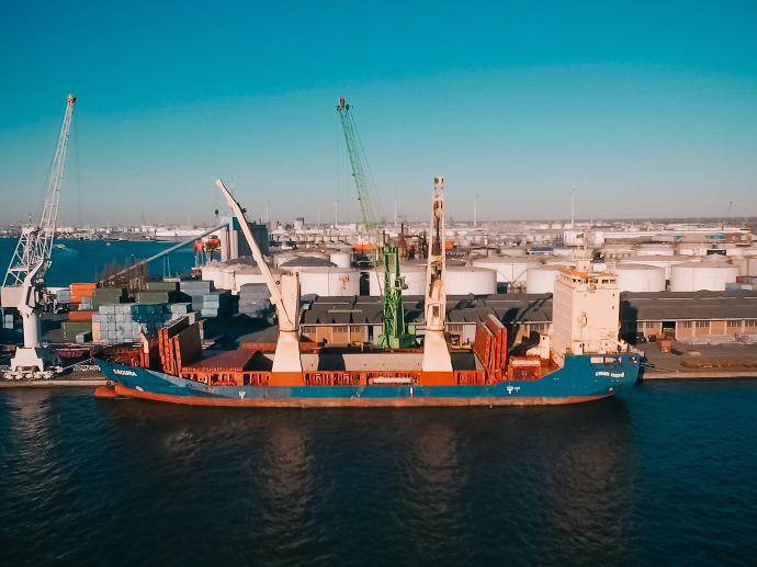 Aerial view of a ship being loaded at a dock